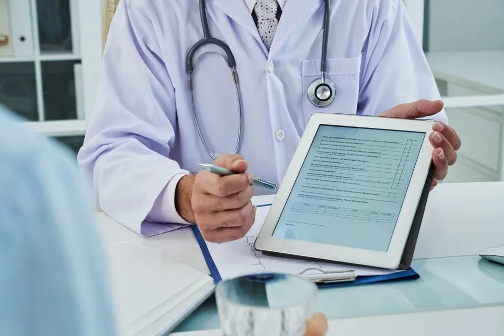 Doctor Holding A Tablet And Pen