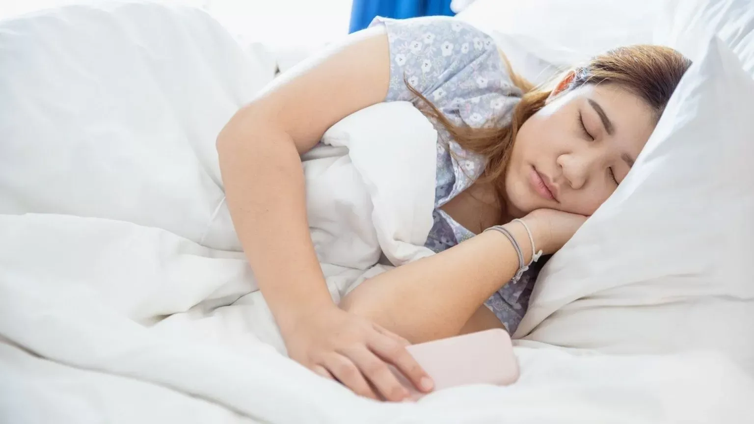 A Woman Sleeping With A Blanket