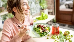 Woman Enjoying A Healthy Salad Meal