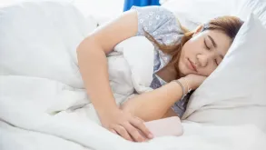 A Woman Sleeping With A Blanket