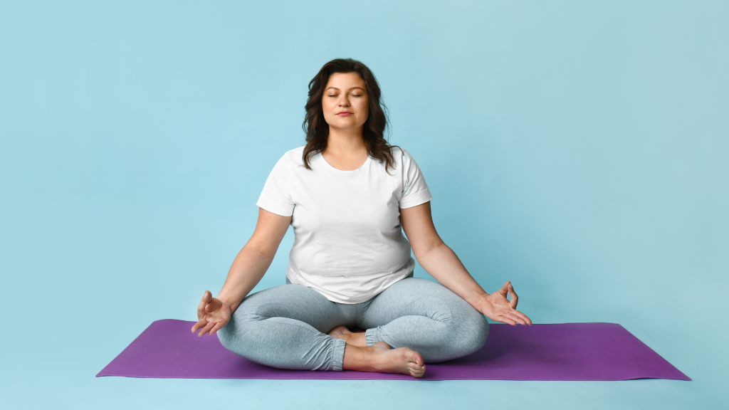 Woman Practicing Yoga on Purple Mat