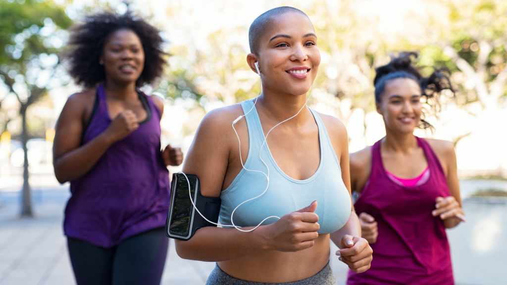 Women Running Outdoors With Smiling Faces