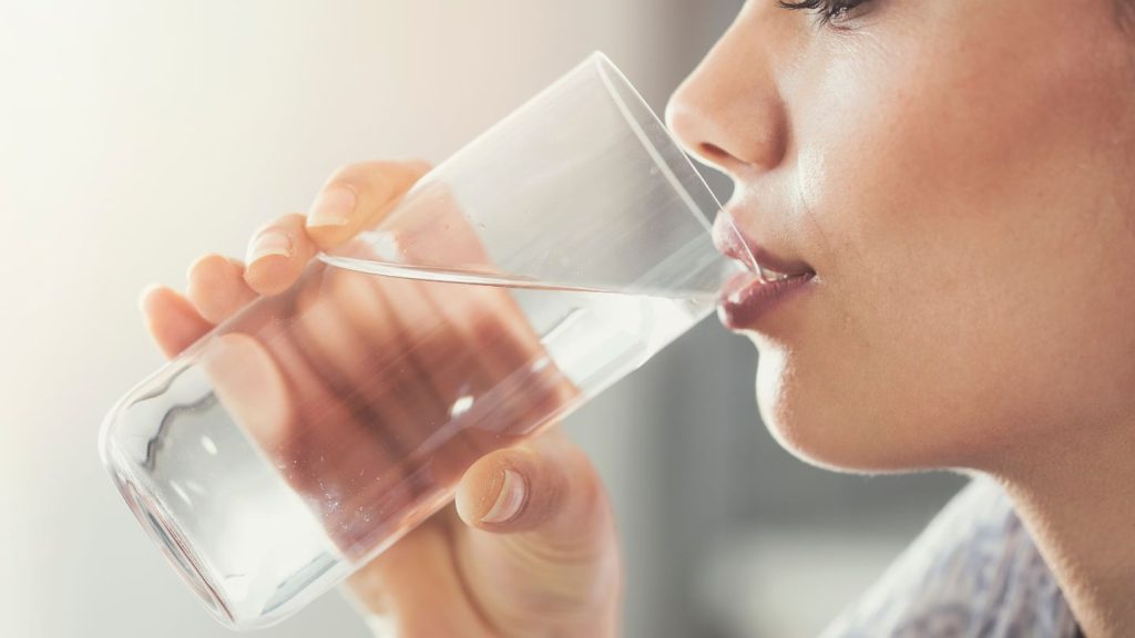 Woman Drinking A Glass Of Water
